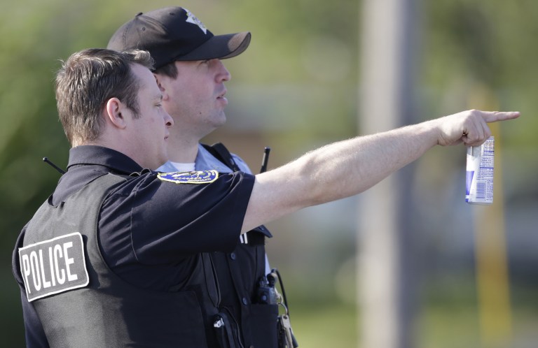 Police seized 26 illegal guns and more than $45,000 in narcotics, including heroin and cocaine, according to a Chicago Police Department spokesman. (AP Photo/M. Spencer Green)