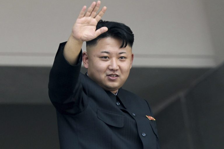 North Korean leader Kim Jong Un waves to spectators and participants of a mass military parade celebrating the 60th anniversary of the Korean War armistice in Pyongyang, North Korea. (AP Photo/Wong Maye-E)