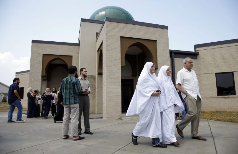 FILE - In an Aug. 10, 2012 file photo, worshipers leave the Islamic Center of Murfreesboro after midday prayers in Murfreesboro, Tenn. Opponents of the new Tennessee mosque want a federal judge to give them a say in a religious discrimination case involving the building. For two years the group fought to shut down construction of the Islamic Center of Murfreesboro in state court. On Thursday, ,Aug. 23, 2012, the building received its final certificate of occupancy and it is unclear what the mosque opponents could achieve at this point if they were allowed to intervene in the federal case.  (AP Photo/Mark Humphrey, File)