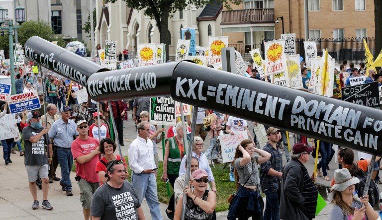 Opponents of the Keystone XL oil pipeline have begun constructing a series of large solar arrays to block the path of the pipeline project in Nebraska. (AP Photo/Nati Harnik)