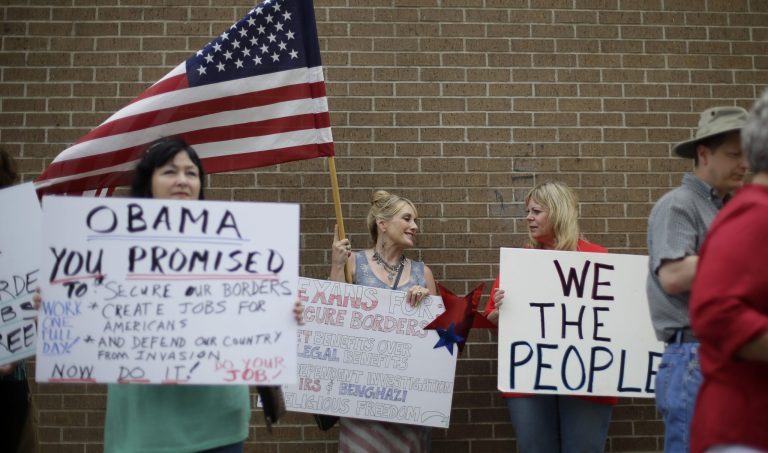 Protesters gather outside the Mexican Consulate, Friday, July 18, 2014, in Austin, Texas.   Prospects for action on the U.S.-Mexico border crisis faded Thursday as lawmakers traded accusations rather than solutions, raising chances that Congress will go into its summer recess without doing anything about the tens of thousands of migrant children streaming into South Texas. (AP Photo/Eric Gay)