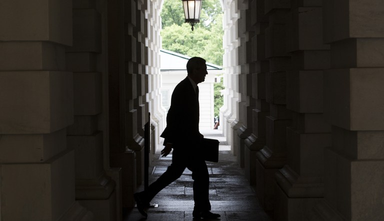 The silhouette of Robert Mueller, former director of the Federal Bureau of Investigation (FBI) and special counsel for the U.S. Department of Justice, is seen as he leaves the U.S. Capitol Building following a meeting with the Senate Judiciary Committee in Washington, D.C., U.S., on Tuesday, June 20, 2017. Senators on the Intelligence Committee pressed administration officials Wednesday to disclose more about the extent of Russian hacking attempts during last year's election after the government disclosed that 21 states had been targeted.