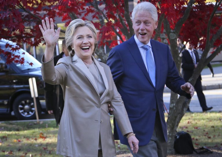 FILE - In this Nov. 8, 2016, file photo, then-Democratic presidential candidate Hillary Clinton, and her husband former President Bill Clinton, greet supporters after voting in Chappaqua, N.Y. The FBI is investigating allegations of corruption connected to the Clinton Foundation while Hillary Clinton was secretary of state. That's according to a person familiar with the investigation who spoke on condition of anonymity to discuss it. (AP Photo/Seth Wenig, File)