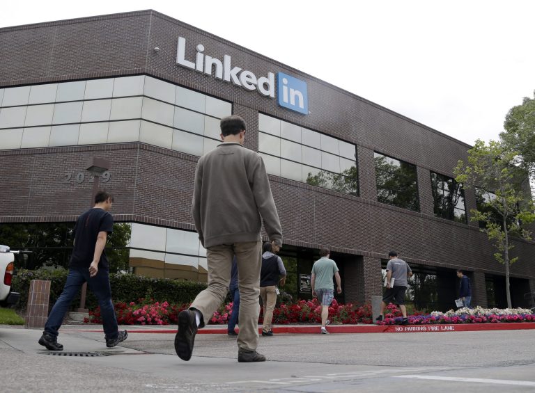 FILE - In this May 8, 2014 file photo, people walk outside of LinkedIn headquarters on in Mountain View , Calif. LinkedIn Corp. reports quarterly financial results on Thursday, July 31, 2014. (AP Photo/Marcio Jose Sanchez, File)