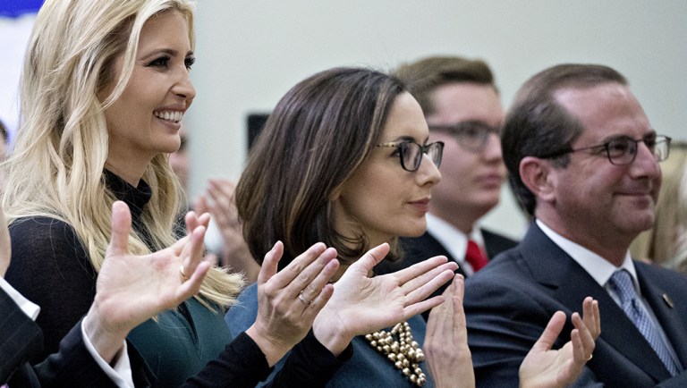 Alexander Acosta, U.S. labor secretary, from left, Ivanka Trump, assistant to U.S. President Donald Trump, Sarah Flores, director of public affairs at the U.S. Department of Justice (DOJ), and Alex Azar, secretary of Health and Human Services (HHS), applaud during the Generation Next forum in the Eisenhower Executive Office Building in Washington, D.C., U.S., on Thursday, March 22, 2018. Trump today took his boldest step to level the economic playing field with China, ordering sweeping tariffs on Chinese goods in a move that could escalate already tense trade relations between the worlds two biggest economies. Photographer: Andrew Harrer/Bloomberg
