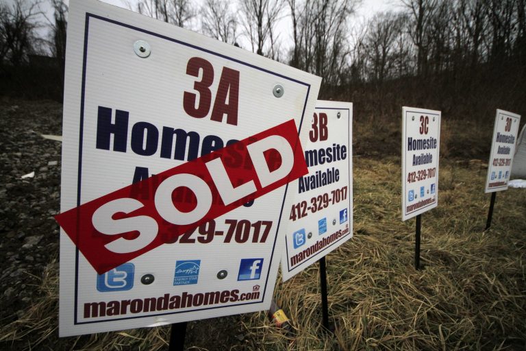 In this Monday, Jan. 13, 2014, photo, a  sold sign is placed on a homesite in the Grace Manor townhouse development in Robinson Township, Pa. Freddie Mac, the mortgage company, releases weekly mortgage rates, on Thursday, Jan. 16, 2014.(AP Photo/Gene J. Puskar)