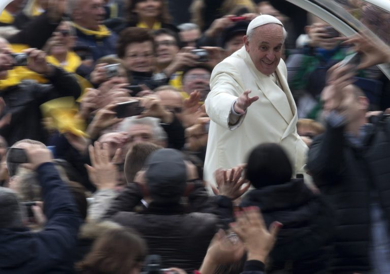 Pope Francis waves to faithful from his pope-mobile as he arrives for his weekly general audience in St. Peter's Square at the Vatican, Wednesday, Jan. 22, 2014. (AP Photo/Alessandra Tarantino)