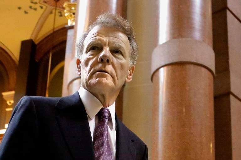 FILE - In this May  30, 2014 file photo, Illinois House Speaker Michael Madigan, D-Chicago, heads into his office at the state Capitol in Springfield Ill. National Republican legislative groups say eroding Democratic control in the Illinois House is a top goal this November. Officials from the Republican Legislative Campaign Committee and the Republican State Leadership Committee are having a conference in Colorado this week with the hope of eliminating House Speaker Michael Madigan's veto-proof majority, which the Chicago Democrat and Illinois Democratic Party chair holds by a one-vote margin. Supermajority status allows Democrats to pass politically difficult pieces of legislation without any Republican votes. (AP Photo/Seth Perlman, File)