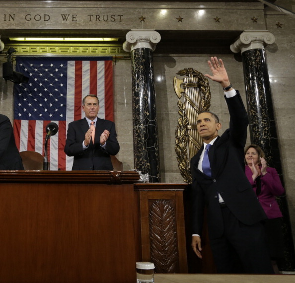 WASHINGTON, DC - FEBRUARY 12:  U.S. President Barack Obama waves and House Speaker John Boehner (R-OH) applauds after the president gave his State of the Union address during a joint session of Congress at the U.S. Capitol February 12, 2013 in Washington, DC. Facing a divided Congress, Obama focused his speech on new initiatives designed to stimulate the U.S. economy. (Photo by Charles Dharapak-Pool/Getty Images)