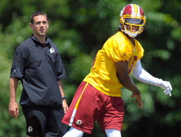 ASHBURN VA JUNE13 :  Redskins' quarterbacks coach Matt LaFleur, left, watches Starting QB Robert Griffin III during passing drills on day 3 of Mini Camp at Redskins Park in Ashburn VA, June 13, 2012 (Photo by John McDonnell/The Washington Post via Getty Images)