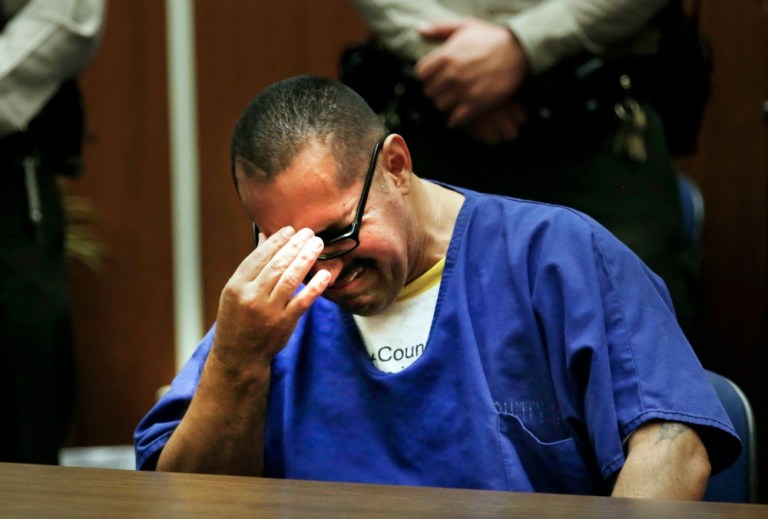Luis Vargas, who has been in prison for 16 years, reacts in court as he is exonerated Monday, Nov. 23, 2015, in Los Angeles. A judge exonerated Vargas, convicted of three rapes, after DNA evidence linked the crimes to a serial rapist wanted for assaults dating back two decades. (Francine Orr/Los Angeles Times via AP, Pool)