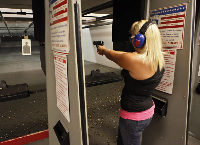Sarah Bard, of Gilbert, shoots at Caswell Shooting Club in Mesa, Ariz. (AP Photo/Matt York)