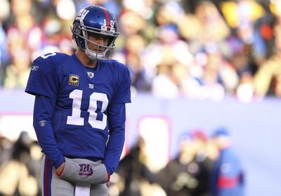 Al Bello/Getty Images
Eli Manning threw three interceptions in the Giants'loss to the Redskins on Sunday.