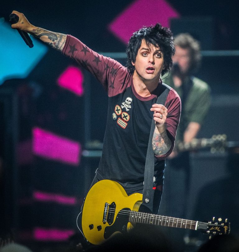   FILE - This Sept. 21, 2012 file photo shows Billie Joe Armstrong of Green Day on stage at the iHeart Radio Music Festival at the MGM Grand Arena in Las Vegas. The Grammy-winning punk band announced new tour dates, Monday, Dec. 31, 2012. Green Day's tour is scheduled to begin in March 28, 2013, in Chicago. (Photo by Eric Reed/Invision/AP, file)  