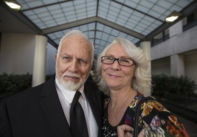 Dan and Fran Keller pose outside of the Travis County, Texas, courthouse. They are trying to prove their innocence in the infamous day care sexual assault case from the early 1990s. (AP Photo/Austin American-Statesman, Ricardo B. Brazziell)