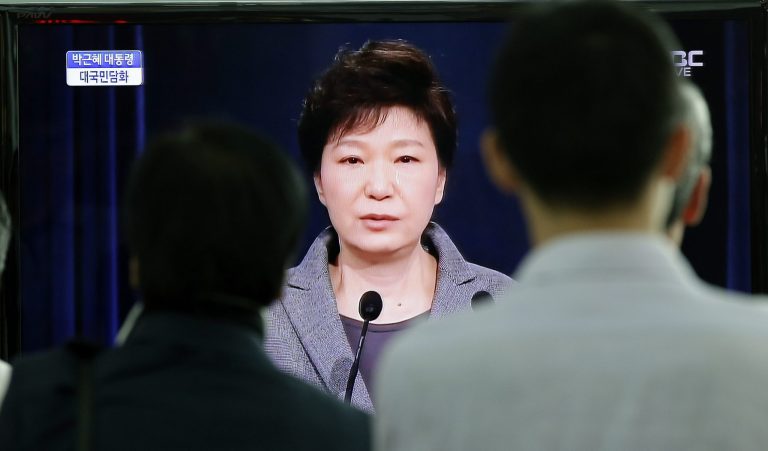 People watch a live television program showing South Korean President Park Geun-hye's speech to the nation regarding the sunken ferry Sewol at the Seoul Train Station in Seoul, South Korea, Monday, May 19, 2014. South Korea's president said Monday she will push to disband the coast guard in the wake of last month's ferry disaster that left more than 300 people dead or missing, calling its rescue operations after the disaster a failure. (AP Photo/Lee Jin-man)