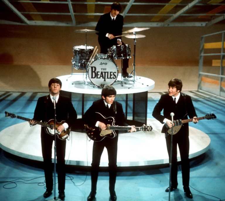 In this Feb. 9, 1964 file photo, The Beatles, from left, Paul McCartney, George Harrison, Ringo Starr on drums, and John Lennon perform on CBS' "The Ed Sullivan Show" in New York. The Beatles made their first appearance on "The Ed Sullivan Show," America's must-see weekly variety show, on Sunday, Feb. 9, 1964, and officially kicked off Beatlemania. (AP Photo, File)
