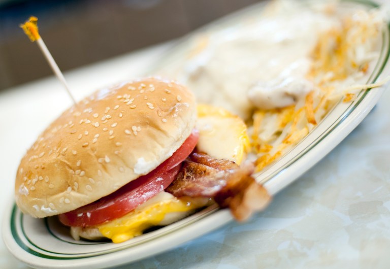 FILE - In this Wednesday, June 26, 2013, file photo, a breakfast sandwich is photographed at the Triple XXX restaurant in West Lafayette, Ind. Breakfast is now being served with a dose of sticker shock. The cost of morning staples like bacon, coffee and orange juice is surging on a host of global supply problems, from drought in Brazil to disease on U.S. pig farms.  (AP Photo/Journal & Courier, Brent Drinkut)