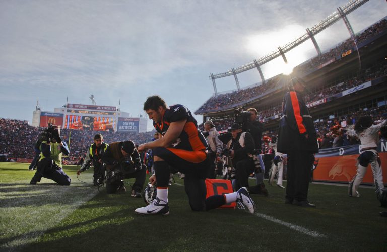 Denver Broncos quarterback Tim Tebow prays before playing the Kansas City Chiefs in an NFL football game, Sunday, Jan. 1, 2012, in Denver. (AP/Julie Jacobson)
