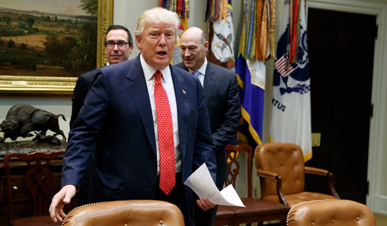 Steven Mnuchin and Gary Cohn, two of President Trump's top economic advisers, are headed to Capitol Hill Tuesday to discuss tax reform with Republican leaders. (AP Photo/Evan Vucci)