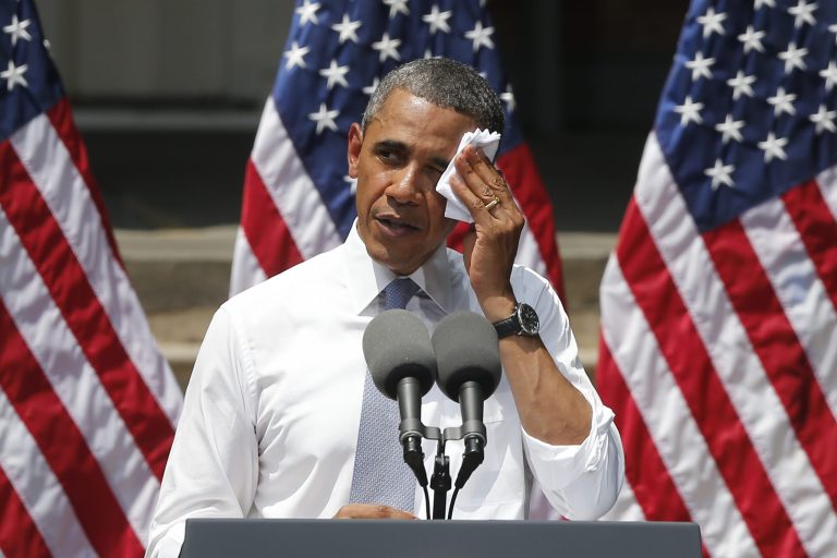 FILE - In this June 2013 file photo, President Barack Obama wipes perspiration from his face as he speaks about climate change at Georgetown University in Washington.   Having spent political capital fighting climate change at home, President Barack Obama will turn his sights overseas next week, urging fellow heads of state to be as ambitious as possible as they negotiate a make-or-break global treaty to be finalized in Paris next year.   (AP Photo/Charles Dharapak)