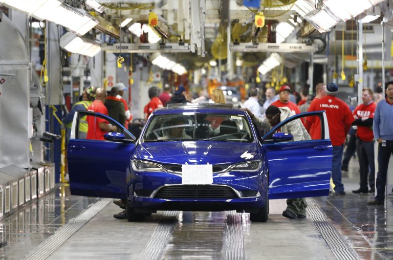 In this March 14, 2014 photo, a 2015 Chrysler 200 automobile moves down the assembly line at the Sterling Heights Assembly Plant in Sterling Heights, Mich. Automakers report sales for May on Tuesday, June 3, 2014. (AP Photo/Paul Sancya)