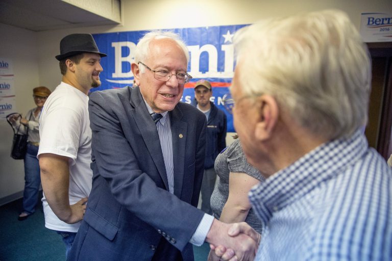 Democratic Presidential candidate Sen. Bernie Sanders greets supporters during a visit to his Iowa campaign headquarters on June 13, 2015 in Des Moines. (Photo by Scott Olson/Getty Images)