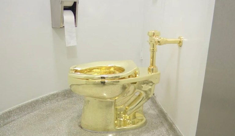 Known to be a satirical and provocative artist, Maurizio Cattelan has told reporters he leaves the interpretation of his work to his audience, but described the toilet 
