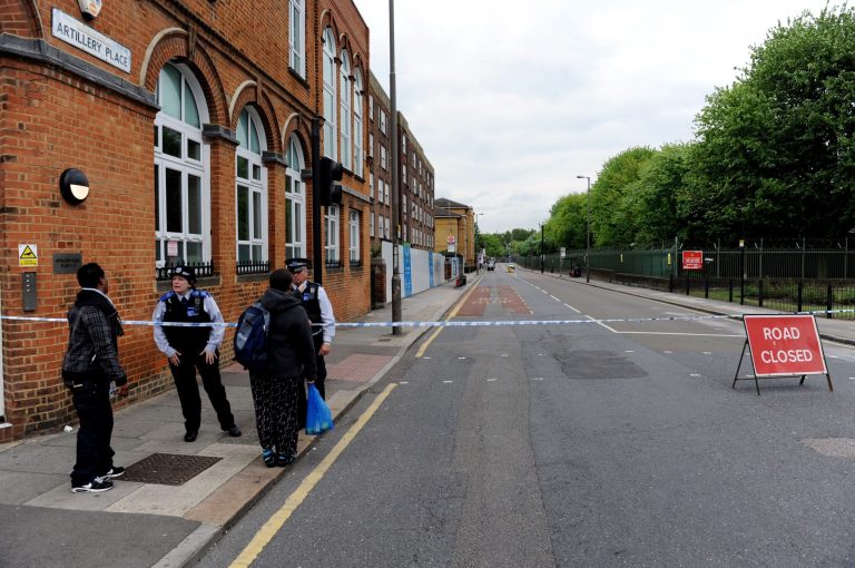 Artillery Place road is closed in Woolwich southeast London near the scene where British officials said one person has died and at least two people have been wounded in an attack on Wednesday May 22, 2013. (AP Photo/Nick Ansell/PA) UNITED KINGDOM OUT