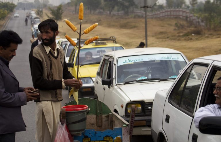   In this Wednesday, Dec. 5, 2012 photo, Drivers queue at a gas station in Islamabad, Pakistan. It has become a familiar site across Pakistan in recent weeks: Long lines of cars and minibuses snaking for hundreds of yards as their frustrated drivers wait to fill up their tanks with natural gas. (AP Photo/B.K. Bangash)  