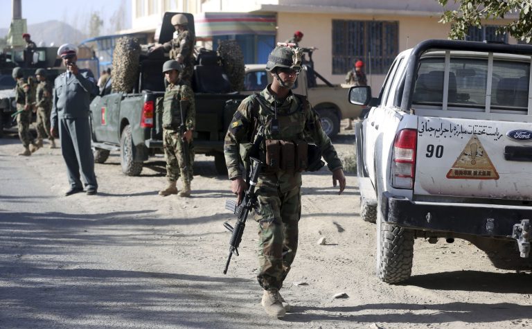 Afghanistan's security forces guard at the site of a suicide attack in Kabul, Afghanistan, Thursday. Officials say that a suicide bomber has killed a few army officers and wounded several people in Kabul, a day after two such attacks killed 11. (AP Photo/Massoud Hossaini)