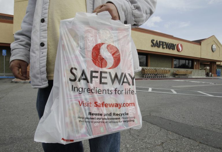 FILE - In this Feb. 23, 2011 file photo, a customer leaves a Safeway store in Cupertino, Calif. Safeway reports quarterly earnings on Wednesday, April 23, 2014. (AP Photo/Paul Sakuma)