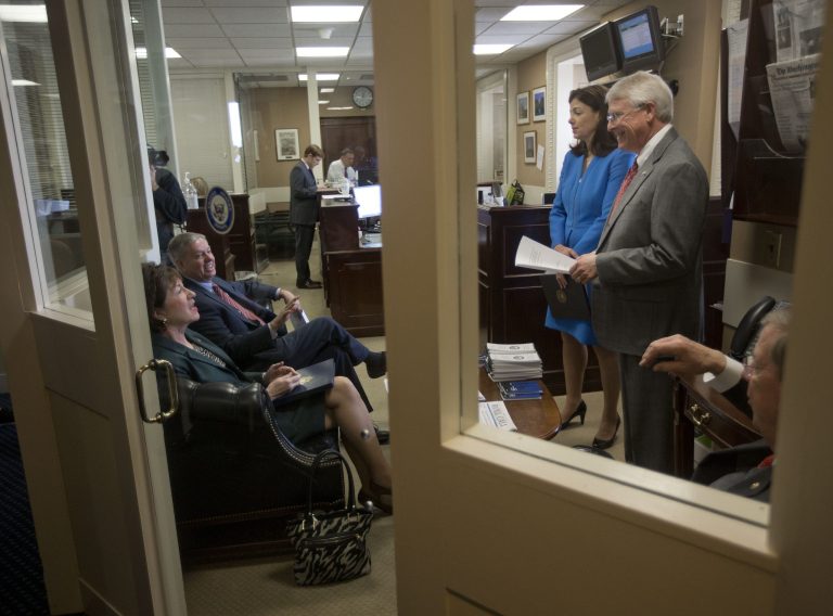 Sen. Kelly Ayotte, R-NH., third from the right, meets with fellow Republican Senators on Capitol Hill in Washington, Wednesday, Jan. 8, 2014, before their joint news conference to discuss unemployment and military pension cuts. Clockwise, from Ayotte are, Sen. Roger Wicker, R-Miss., Sen. Johnny Isakson, R-Ga., Sen. Susan Collins, R-Maine, and Sen. Lindsey Graham, S.C. (AP Photo/Pablo Martinez Monsivais)