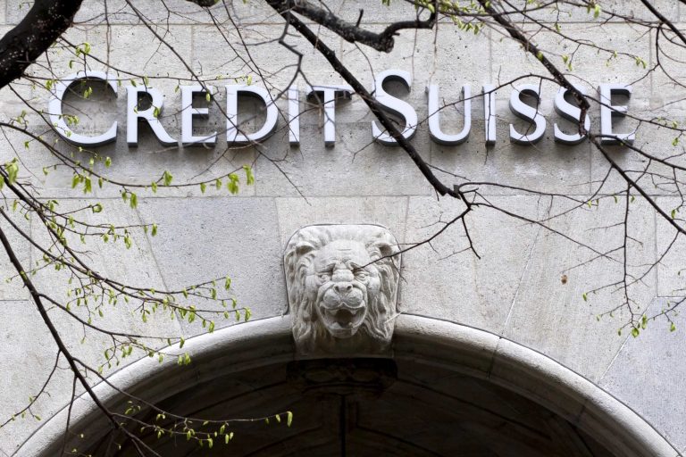 FILE - In this April 3, 2012 file picture the logo of Swiss bank Credit Suisse is photographed at a building in Zurich. Credit Suisse Group says it is raising 8.7 billion Swiss francs (US $8.9 billion) to bolster its capital reserves.  The Swiss bank says 3.8 billion francs come from the placement of so-called contingent convertible bonds underwritten by investors from Qatar, Saudi Arabia and Singapore.  The Zurich-based bank's announced WednesdayJuly 18, 2012 that its second-quarter earnings attributable to shareholders increased 2.6 percent to 788 million francs.  (AP Photo/Keystone/Alessandro Della Bella,File)