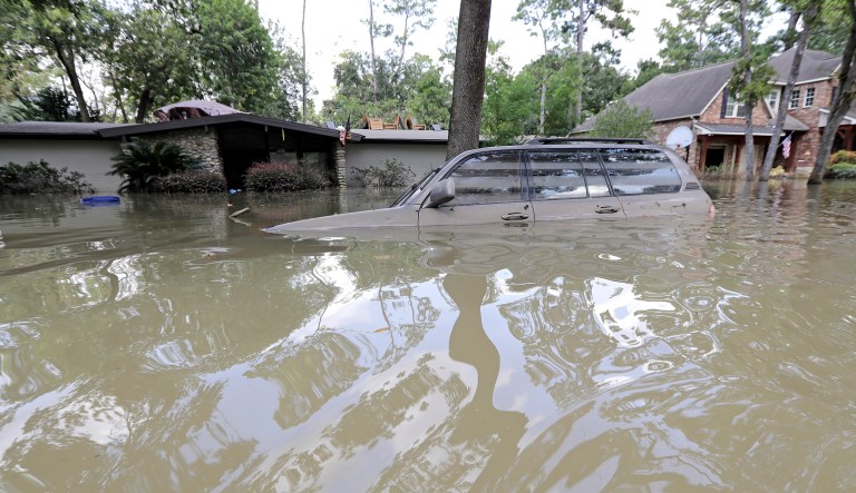 A car is submerged in floodwater in the aftermath of Hurricane Harvey, Monday, Sept. 4, 2017, near the Addicks and Barker Reservoirs in Houston. (AP Photo/David J. Phillip)