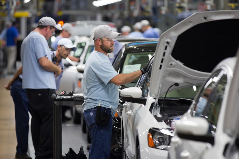 An employee at the Volkswagen plant in Chattanooga, Tenn., works on a Passat sedan. (AP/Erik Schelzig)