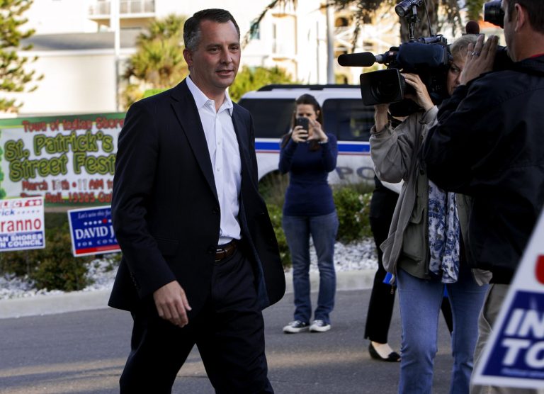 David Jolly arrives at the Indian Shores Town Hall to place his vote in the special election for Florida 13th Congressional District in Indian Shores, Fla., Tuesday, March 11, 2014. (AP Photo/The Tampa Bay Times, Cherie Diez)