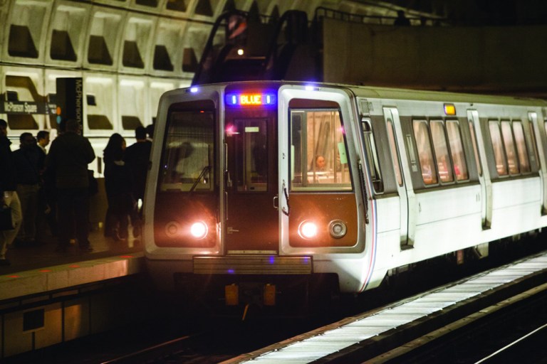 A metro train arriving at Farragut North Metro station.