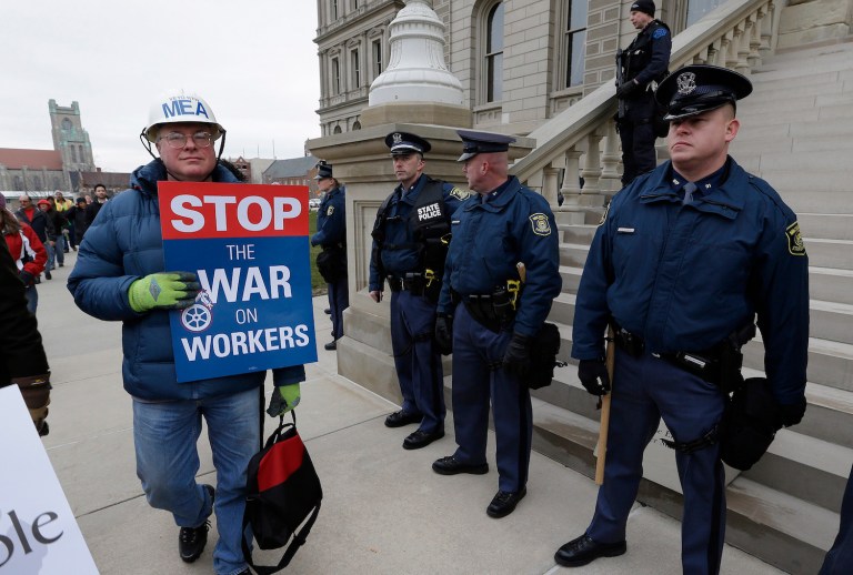 The only ones hurt by right-to-work and its related reforms are the union bosses who see it as a threat to the steady stream of forced union dues they've come to depend on. (AP Photo/Paul Sancya)
