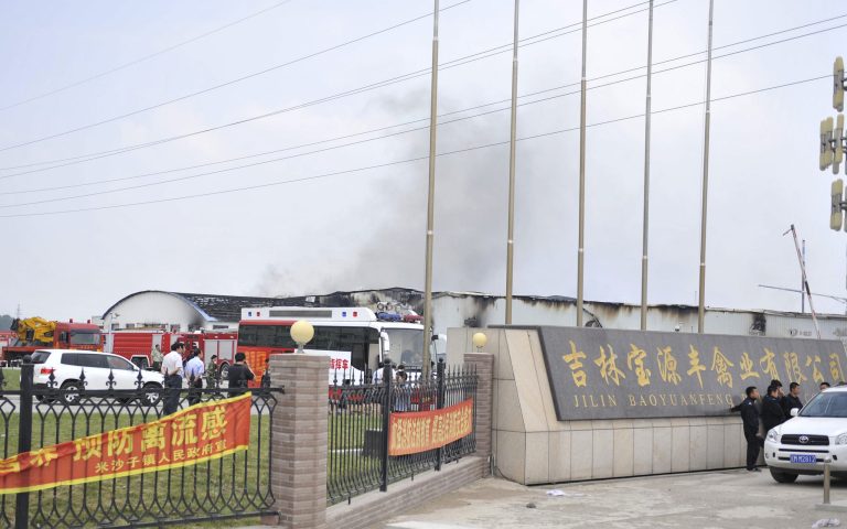 In this photo released by China's Xinhua News Agency, smoke rises from a poultry farm at the Jilin Baoyuanfeng Poultry Company in Mishazi township of Dehui City, northeast China's Jilin Province Monday, June 3, 2013. At least 43 people were killed on Monday morning in the poultry processing plant fire. Reports say 43 people have died in the fire which broke out Monday morning. (AP Photo/Xinhua, Wang Haofei) NO SALES