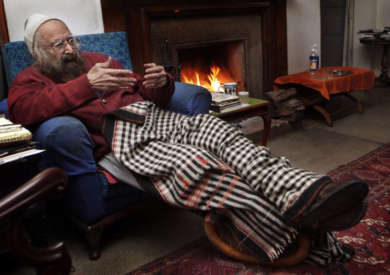 FILE - In this Dec. 20, 2010 file photo, Khushwant Singh, 96, talks sitting next to a fireplace in his house in New Delhi, India. Singh, a force in India's literary world for more than 60 years, has passed away at his New Delhi home, his daughter said, Thursday, March 20, 2014. He was 99. (AP Photo/Manish Swarup, File)