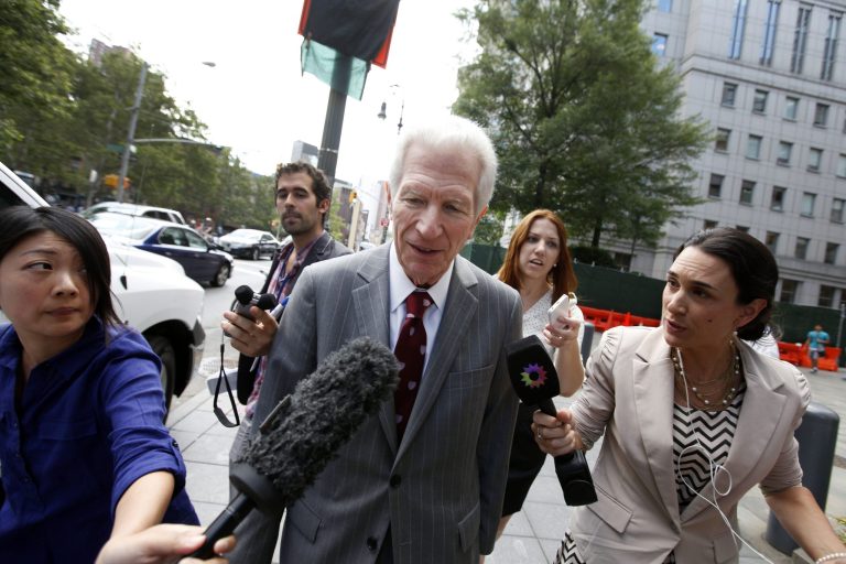 Mediator Daniel Pollack, center, leaves federal court after a hearing regarding Argentina's request to extend deadlines to repay a $1.65 billion debt to U.S. hedge funds, Friday, June 27, 2014, in New York.   Judge Thomas P. Griesa has ordered a U.S. bank to return a $539 million payment from Argentina, saying it was illegal to make. The order by the judge came Friday, three days before Argentina faces default if it fails to pay $832 million to the majority of its debt holders. (AP Photo/Jason DeCrow)
