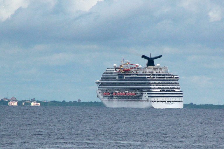 The cruise ship Carnival Magic passes near Cozumel , Mexico, Friday, Oct. 17, 2014. The cruise ship with a Dallas health care worker aboard who is being monitored for signs of Ebola did not receive clearance to dock in Cozumel, a day after Belize refused to let the passenger leave the vessel.  (AP Photo/Angel Castellanos)