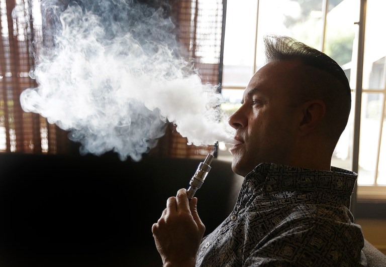 Simply owning an ashtray or allowing a guest to vape could lose you your home. (AP Photo/Ben Margot)