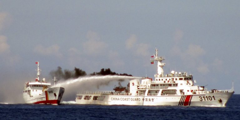 FILE - In this May 4, 2014 file image made from video released by Vietnam Coast Guard, a Chinese coast guard vessel, right, fires water cannon at a Vietnamese vessel off the coast of Vietnam after China deployed an oil rig in disputed South China Sea waters. Vietnam plans to build 32 new coastal patrol vessels, boosting its maritime muscle and surveillance capacities amid an increasingly tense territorial dispute in the South China Sea with its far larger neighbor China. Prime Minister Nguyen Tan Dung said the government would spend US$540 million on the new coast guard and fishery patrol vessels. The decision was made Thursday, July 3, 2014, according to a government statement released later the same day. (AP Photo/Vietnam Coast Guard, File)