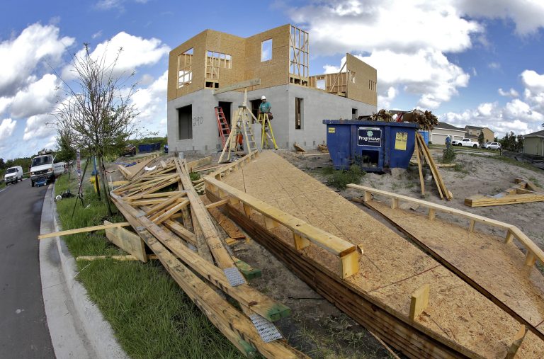 This Wednesday, May 14, 2014 photo taken with a fisheye lens shows a new home under construction in Riverview, Fla. The Conference Board reports on its index of leading economic indicators for May on Thursday, June 19, 2014. (AP Photo/Chris O'Meara)