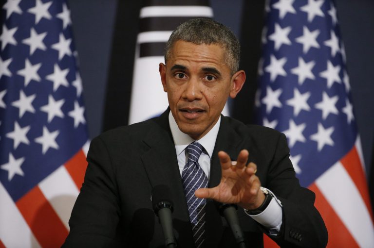 U.S. President Barack Obama answers a reporter's question during a joint news conference with South Korean President Park Geun-hye at the Blue House in Seoul, South Korea, Friday, April 25, 2014. Obama says Japan's use of South Korean 