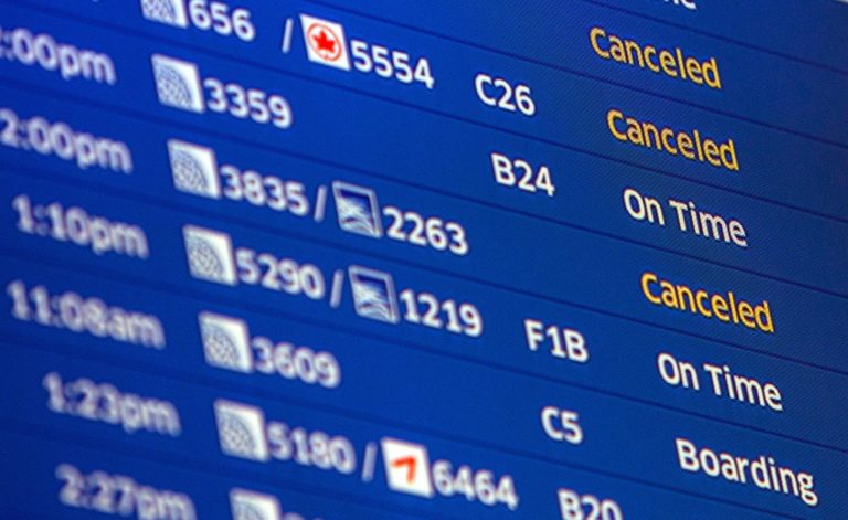 A flight departure board at O'Hare International Airport in Chicago still shows some cancelled flights Monday, Sept. 29, 2014. The Federal Aviation Administration said Monday it is reviewing security practices and how it deals with unexpected incidents throughout its air traffic control facilities following last week's fire at a Chicago-area air traffic facility. (AP Photo/Teresa Crawford)
