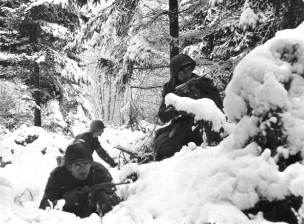 Infantrymen of the 7th US, Infantry Division dig in for an attack in snowdrifts near Amonies (Belgium) January 4, 1945 during the 'Battle of the Bulge'. (Photo by Photo12/UIG/Getty images)