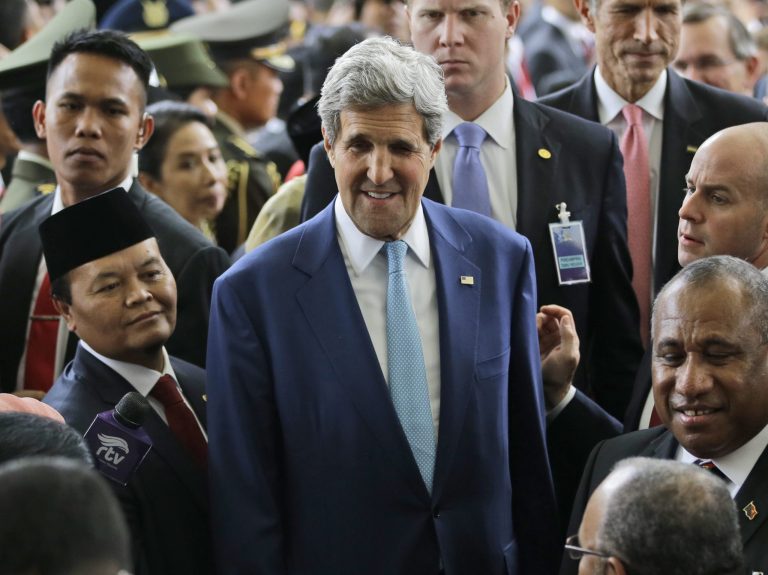 U.S. State Secretary John Kerry, center, leaves the Parliament building after attending the inauguration ceremony of Indonesian President Joko Widodo in Jakarta, Indonesia, Monday, Oct. 20, 2014. Widodo was inaugurated as Indonesia's new president on Monday, facing the challenges of rebooting a slowing economy and working with a potentially hostile opposition that has already landed some early blows against his administration.  (AP Photo/Dita Alangkara)